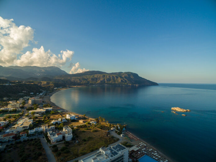 aerial-shot-houses-beach-by-beautiful-calm-ocean-captured-karpathos-greece KARPATHOS
